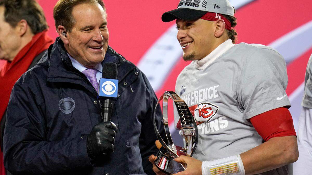 Jim Nantz presents the Lamar Hunt Trophy to Kansas City Chiefs quarterback Patrick Mahomes (15) after the AFC championship NFL game between the Cincinnati Bengals and the Kansas City Chiefs, Sunday, Jan. 29, 2023, at Arrowhead Stadium in Kansas City.