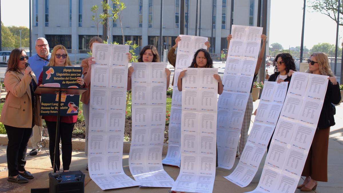 The American Civil Liberties Union of Kansas, in partnership with other area civic groups, organized a demonstration and press conference outside the Wyandotte County Courthouse on Tuesday, calling on elections officials to provide ballot materials in Spanish. Activists held up copies of a petition to support the effort. More than 1,000 residents have signed, according to the ACLU.