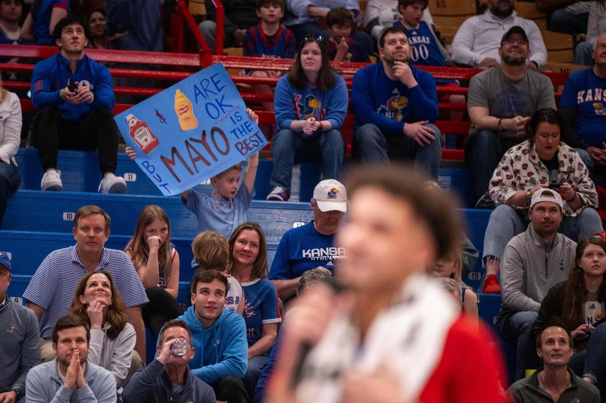 A fan holds up a sign celebrating Kansas Jayhawks senior guard Zeke Mayo during senior speeches on Senior Day, March 8, 2025, at Allen Fieldhouse.