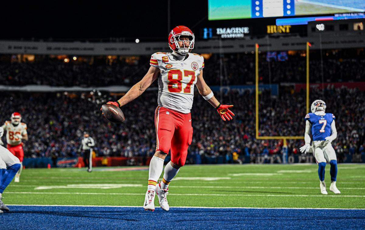 Kansas City Chiefs tight end Travis Kelce celebrates in the end zone after in the second quarter after making a touchdown reception against the Buffalo Bills on January 21, 2024, at Highmark Stadium in Orchard Park, New York.