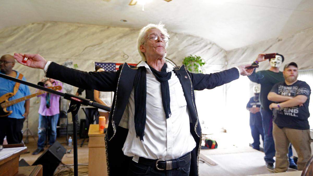 In this July 2015 photo, First Church of Cannabis Founder Bill Levin gestures after smoking a legal "sacrament substitute" during the church's first service. An Indiana judge has ruled against the church's lawsuit that sought to offer its members marijuana as a holy sacrament.