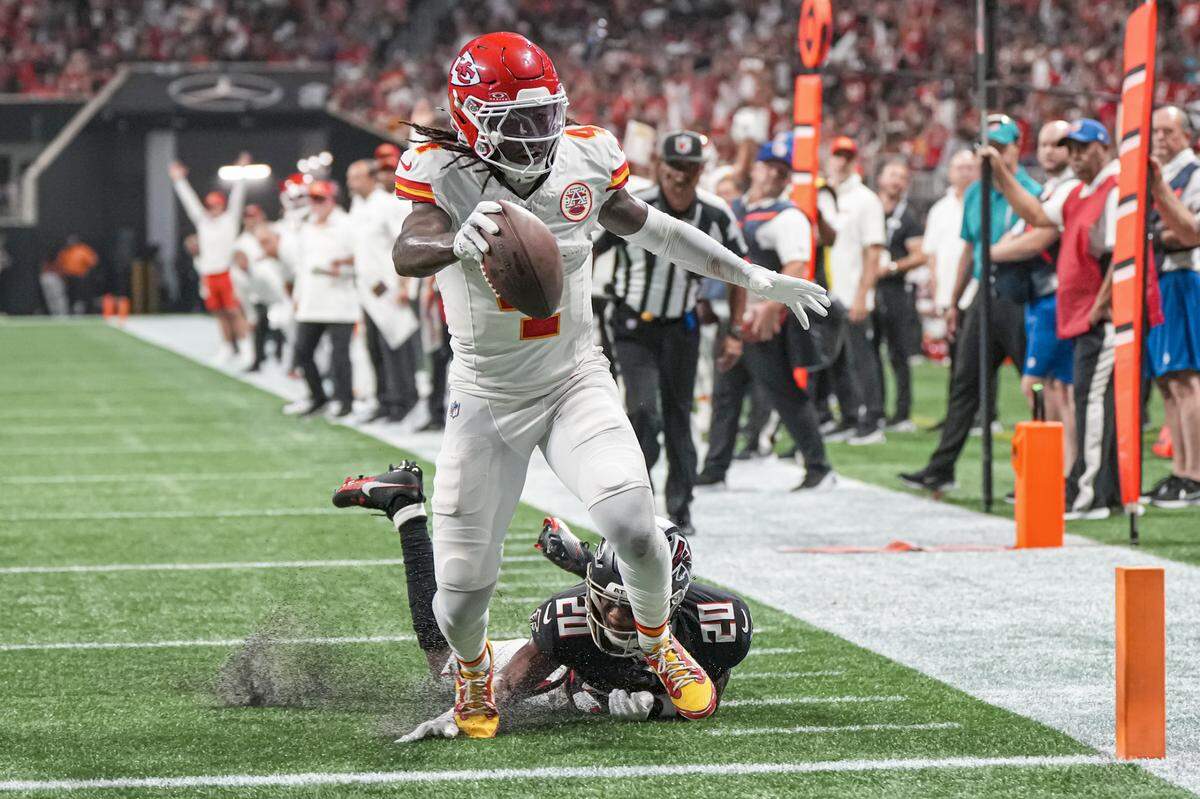 Kansas City Chiefs wide receiver Rashee Rice scores a touchdown past Atlanta Falcons cornerback Dee Alford during Sunday night’s game at the Mercedes-Benz Stadium.