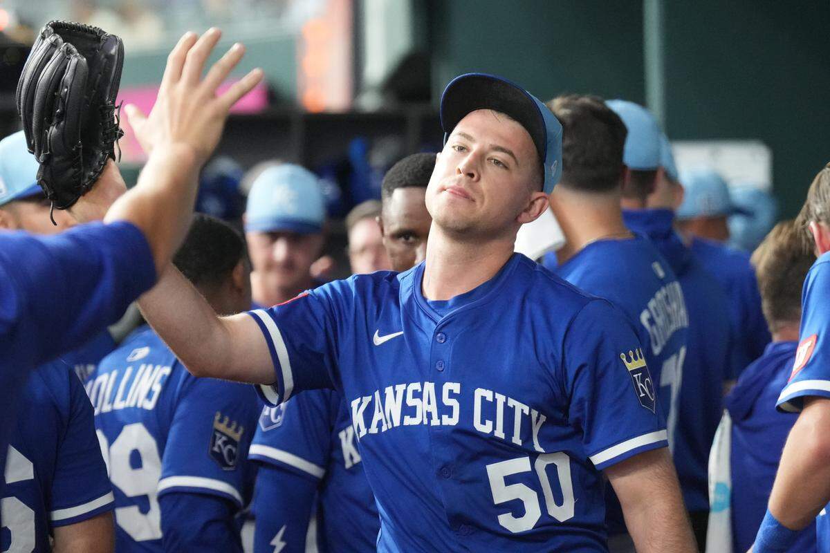 Kansas City Royals starting pitcher Kris Bubic (50) celebrates with teammates after the fifth inning against the Texas Rangers at Globe Life Field on March 25, 2025.