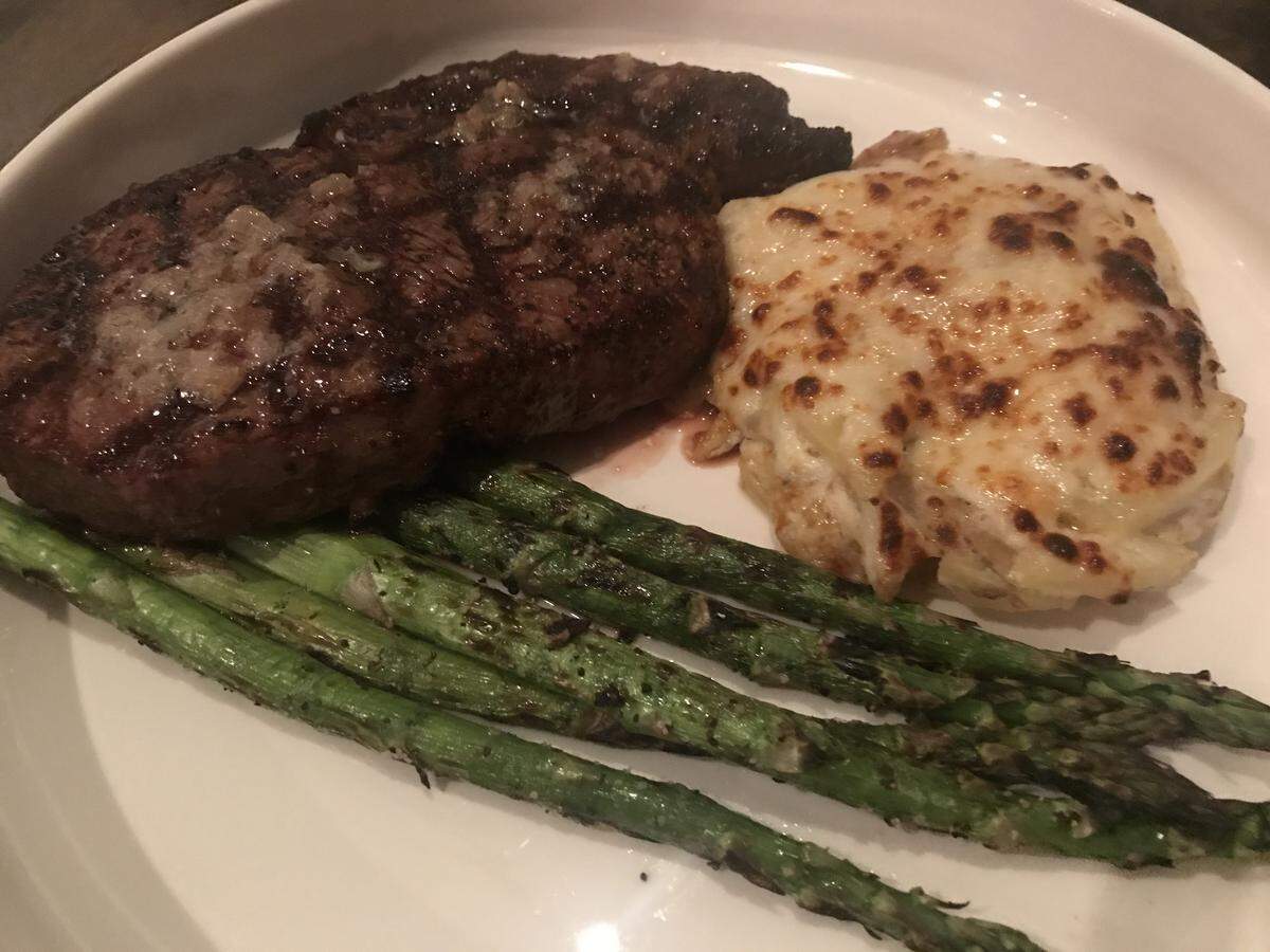 Parker & Vine offers a 12-ounce rib eye with shallot butter and sides of asparagus and lardons scalloped potatoes for $26.