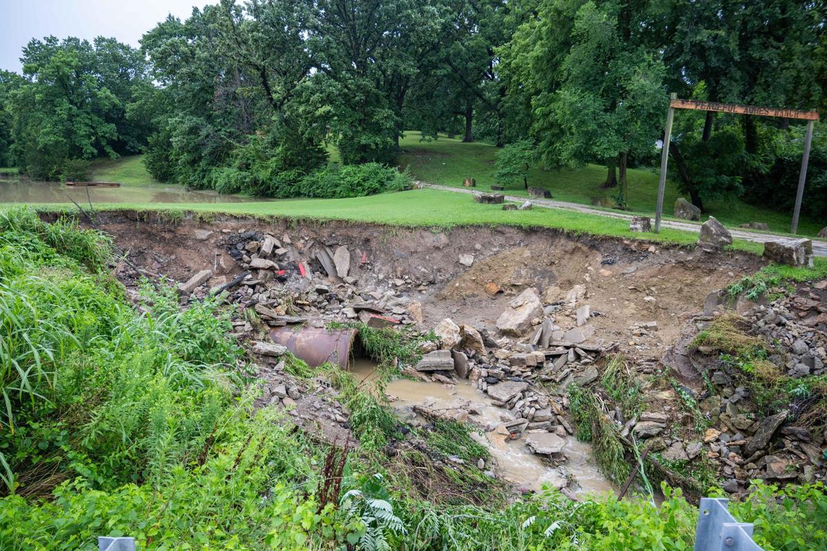 A drainage ditch along Metropolitan Avenue in Kansas City, Kansas, following a flooding in the area on Thursday, July 17, 2025. The pond in the back overflowed after the area received several inches of rain in just a few hours the previous night and into the early morning. The overflowing of the pond caused Tamika Pledger’s home irreparable damage due to flooding.