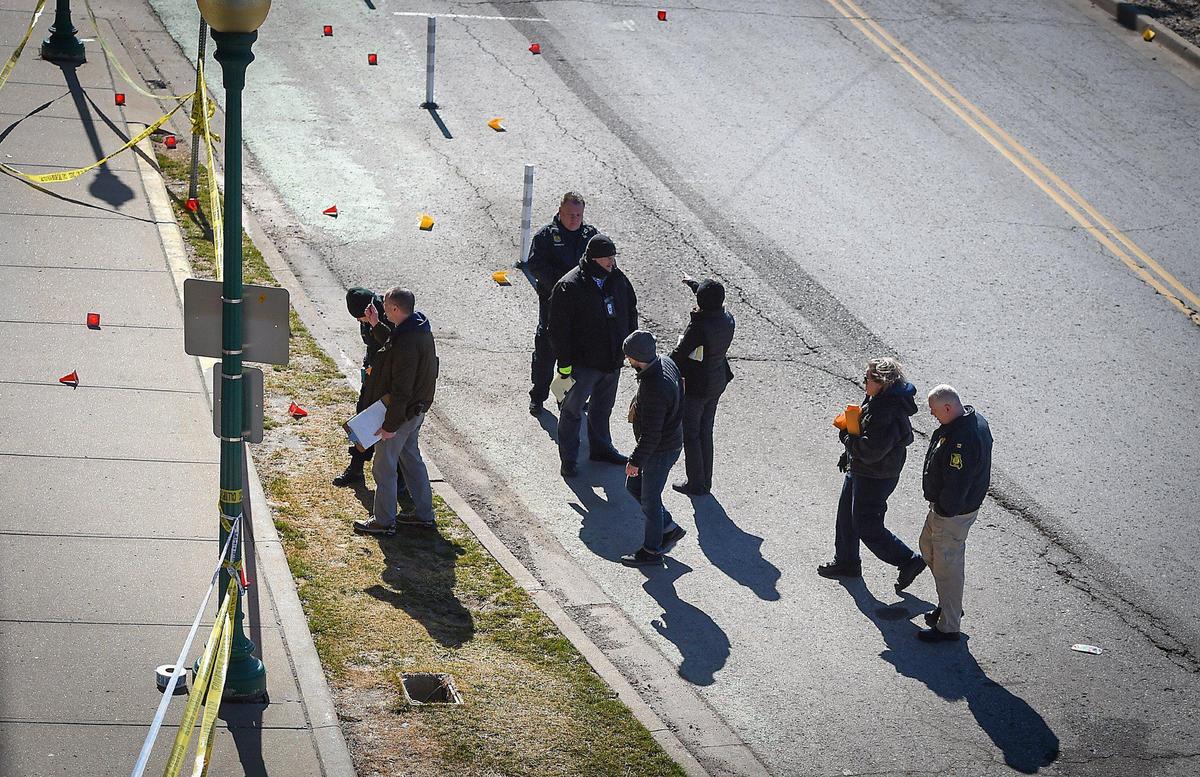 Kansas City police and investigators on Saturday looked over the scene of a shooting on Mill Street in Westport. Shots were fired from a white SUV traveling down the street early Saturday morning. One person is dead, and four others are injured.