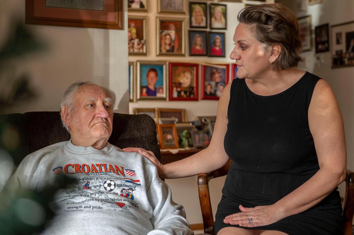 Joseph Panijan and his youngest daughter Gina Dorough sit together in the living room of his sister’s home to speak about the positive impact his wife, Patrica, had on the Croatian community in Kansas City, Kan. on Tuesday, Dec 28, 2021.