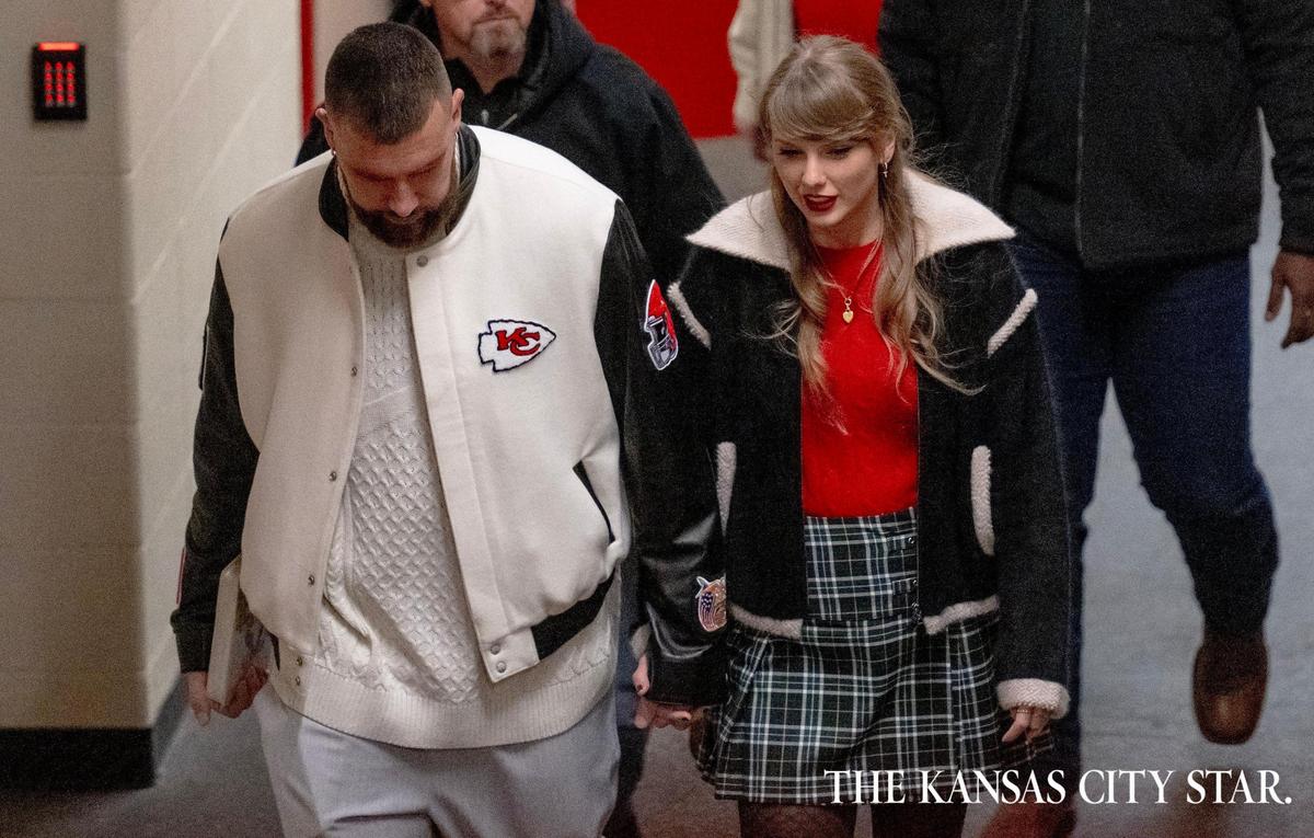 Pop star Taylor Swift holds hands with her boyfriend, Kansas City Chiefs tight end Travis Kelce, as they leave Arrowhead Stadium after the Christmas Day game.