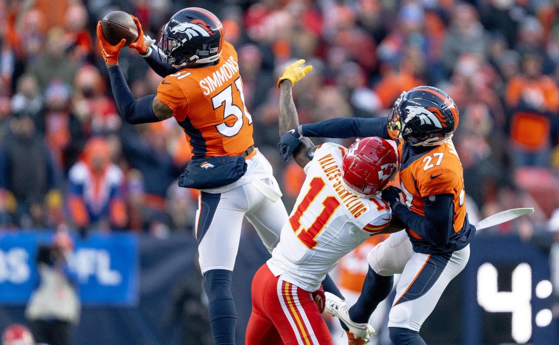 Denver Broncos safety Justin Simmons (31) intercepts a pass against the Kansas City Chiefs during an NFL football game at Empower Field at Mile High on Sunday, Oct. 29, 2023, in Denver.