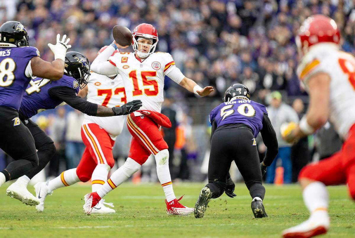 Kansas City Chiefs quarterback Patrick Mahomes (15) throws the ball to tight end Travis Kelce against the Baltimore Ravens during the AFC Championship Game on Sunday, Jan. 28, 2024, in Baltimore.