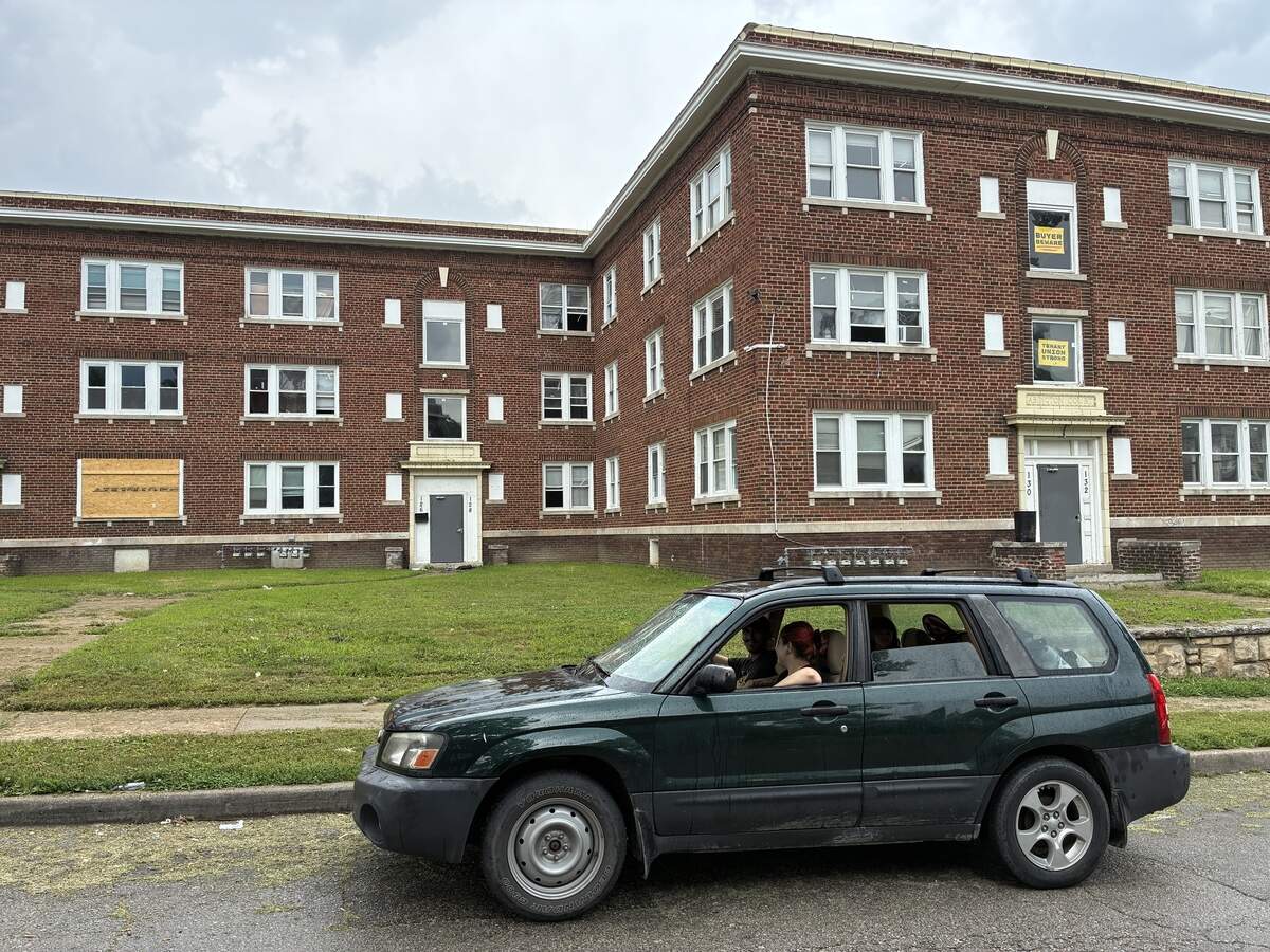 Richard Flores’ car sits outside his apartment building on North Lawn Avenue. Flores said his family used the car for air conditioning after his apartment lost power for weeks.