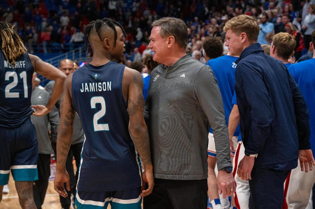 Coach Bill Self greets UNC Wilmington guard Elijah Jamison (2) after the Kansas Jayhawks defeated UNCW 84-66 on Tuesday, Nov. 19, 2024, at Allen Fieldhouse.