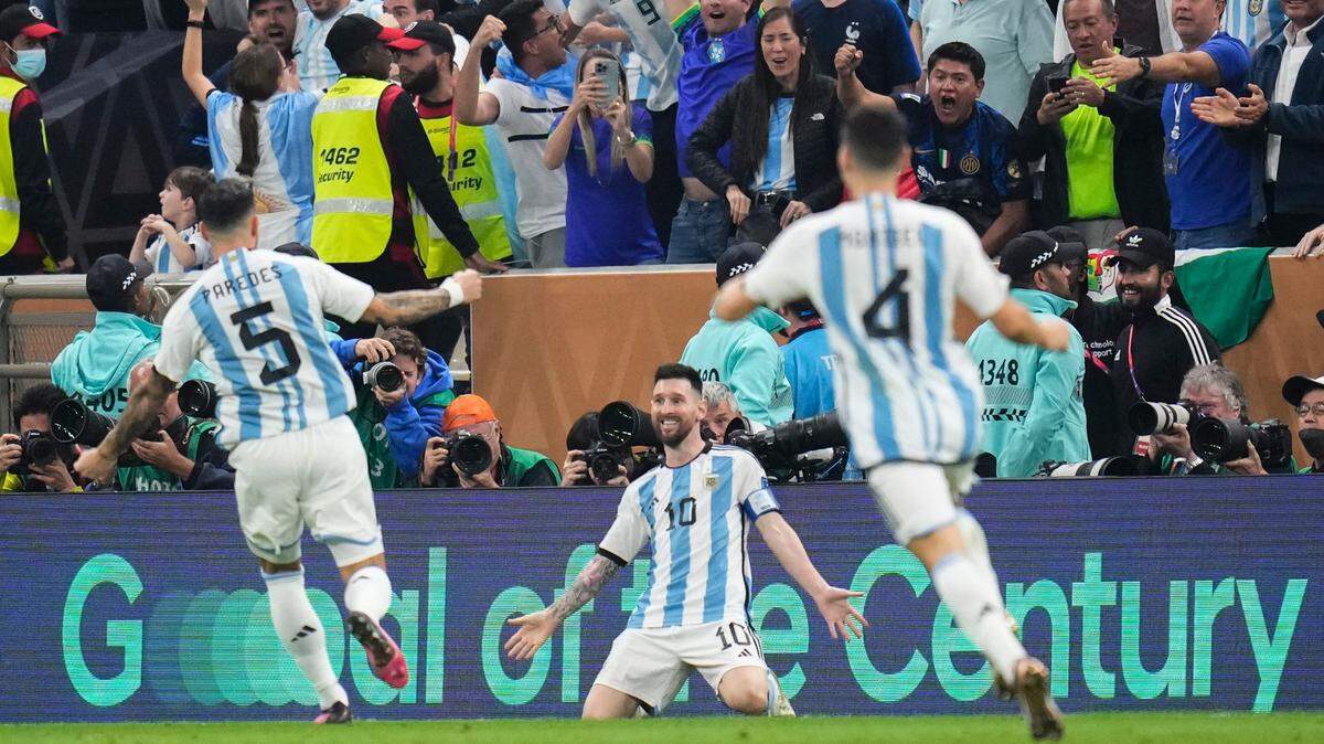 In the World Cup championship match, Argentina’s Lionel Messi celebrates one of his goals against France on Sunday at Lusail Stadium in Lusail, Qatar.