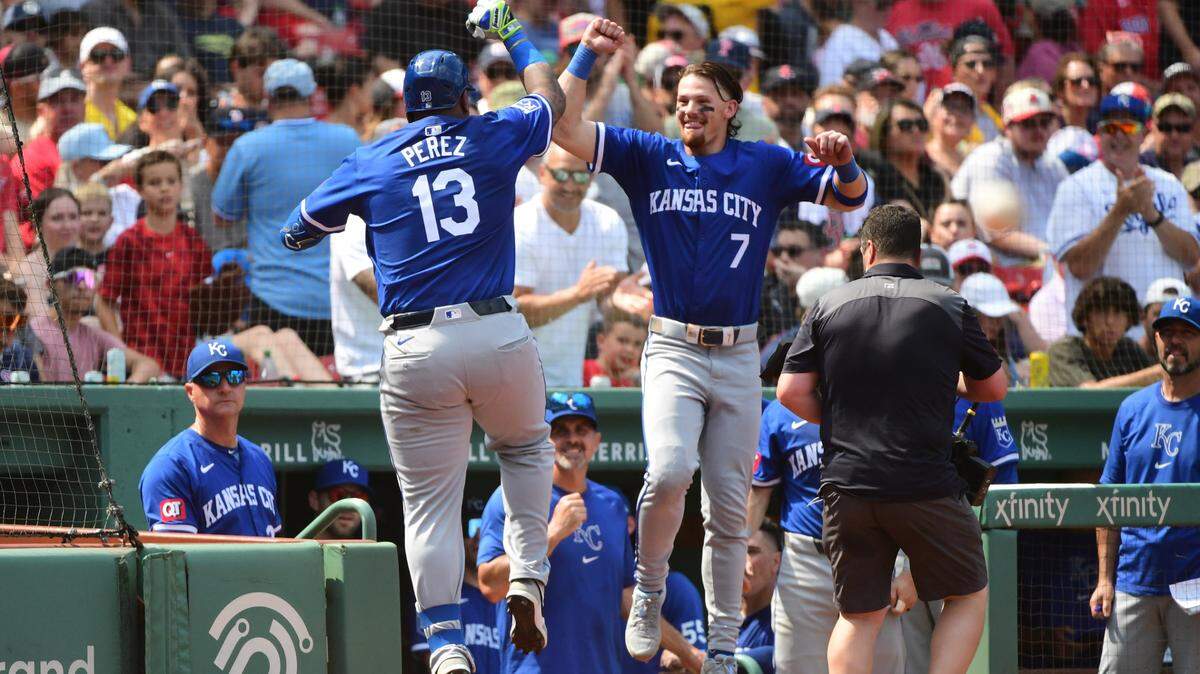 Kansas City Royals designated hitter Salvador Perez celebrates with shortstop Bobby Witt Jr. after hitting a home run during the sixth inning of Sunday’s game against the Boston Red Sox at Fenway Park.