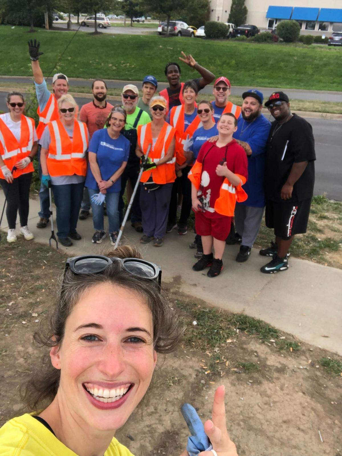 Alicia Grindstaff and neighbors who joined her for a cleanup near Arrowhead Stadium.