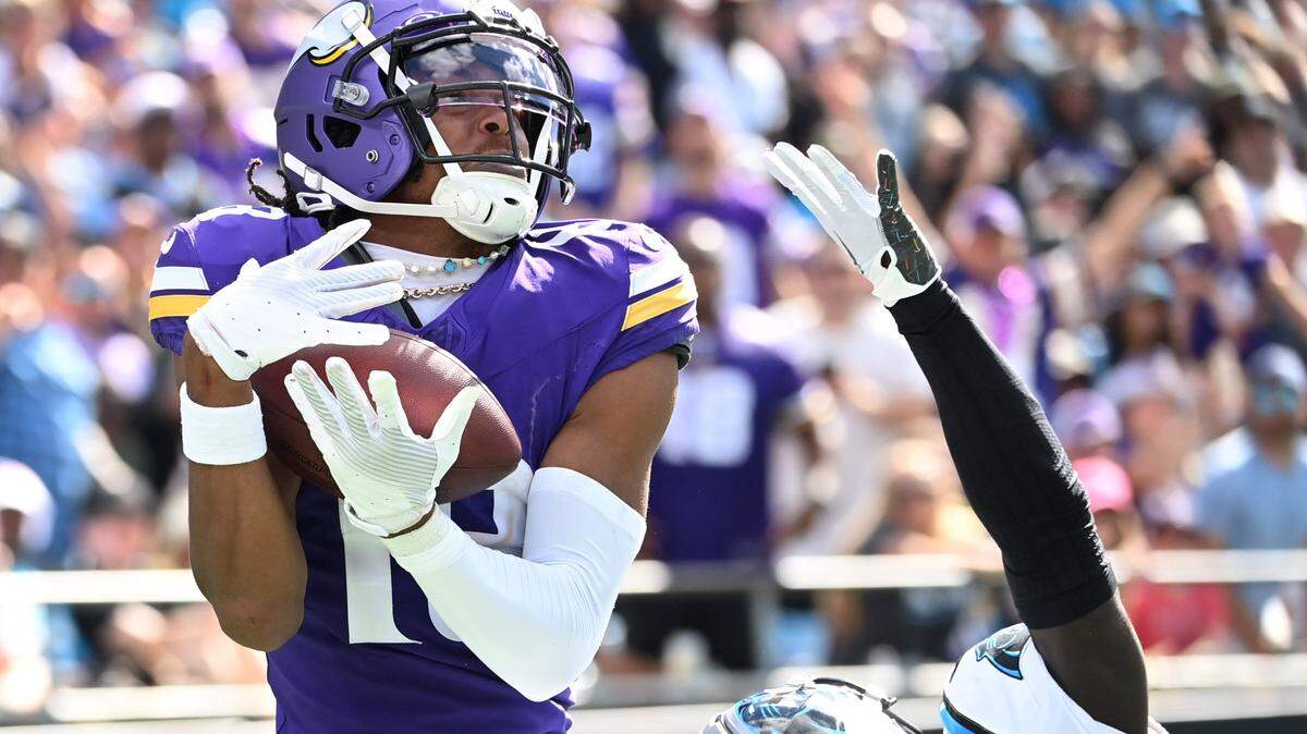 Minnesota Vikings wide receiver Justin Jefferson (18) catches a touchdown pass as Carolina Panthers cornerback D’Shawn Jamison (29) defends in the third quarter at Bank of America Stadium.