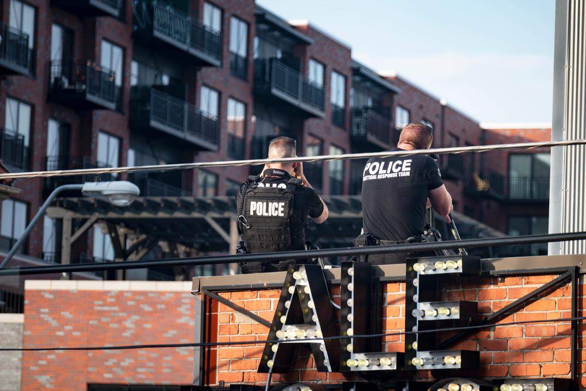 Kansas City Police Department snipers are engaged in a standoff at the 4100 block of Broadway Boulevard near Westport on July 1, 2022, in Kansas City.