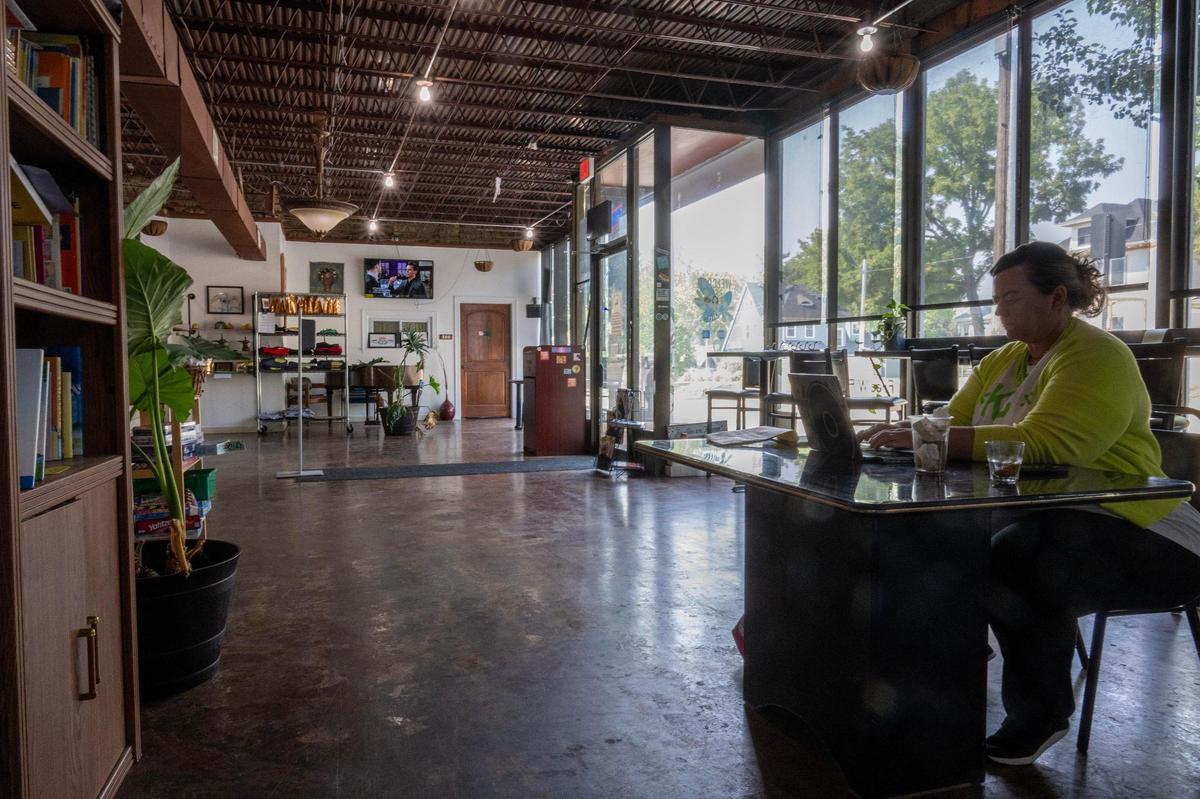 Overhead lights illuminate the dinning area at Equal Minded Cafe on Thursday, Sept. 7, 2023, in Kansas City.