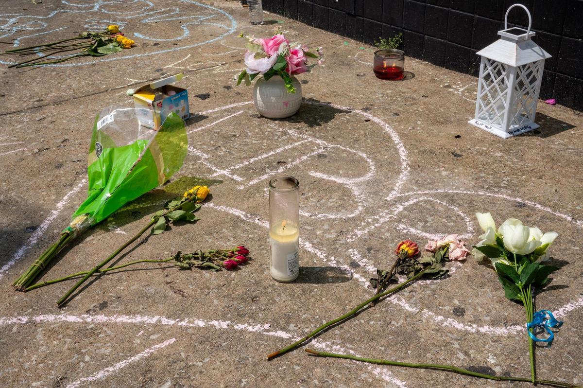 Messages written in chalk are seen on the sidewalk outside Klymax Lounge on Monday, May 22, 2023, in Kansas City.