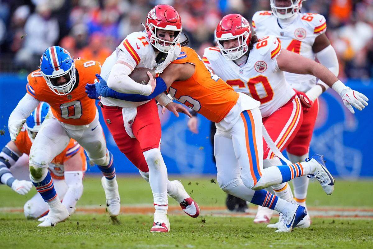 Broncos linebacker Nik Bonitto (No. 15) sacks Kansas City Chiefs quarterback Carson Wentz during the teams’ NFL Week 18 game at Empower Field at Mile High in Denver on Sunday, Jan. 5, 2025.