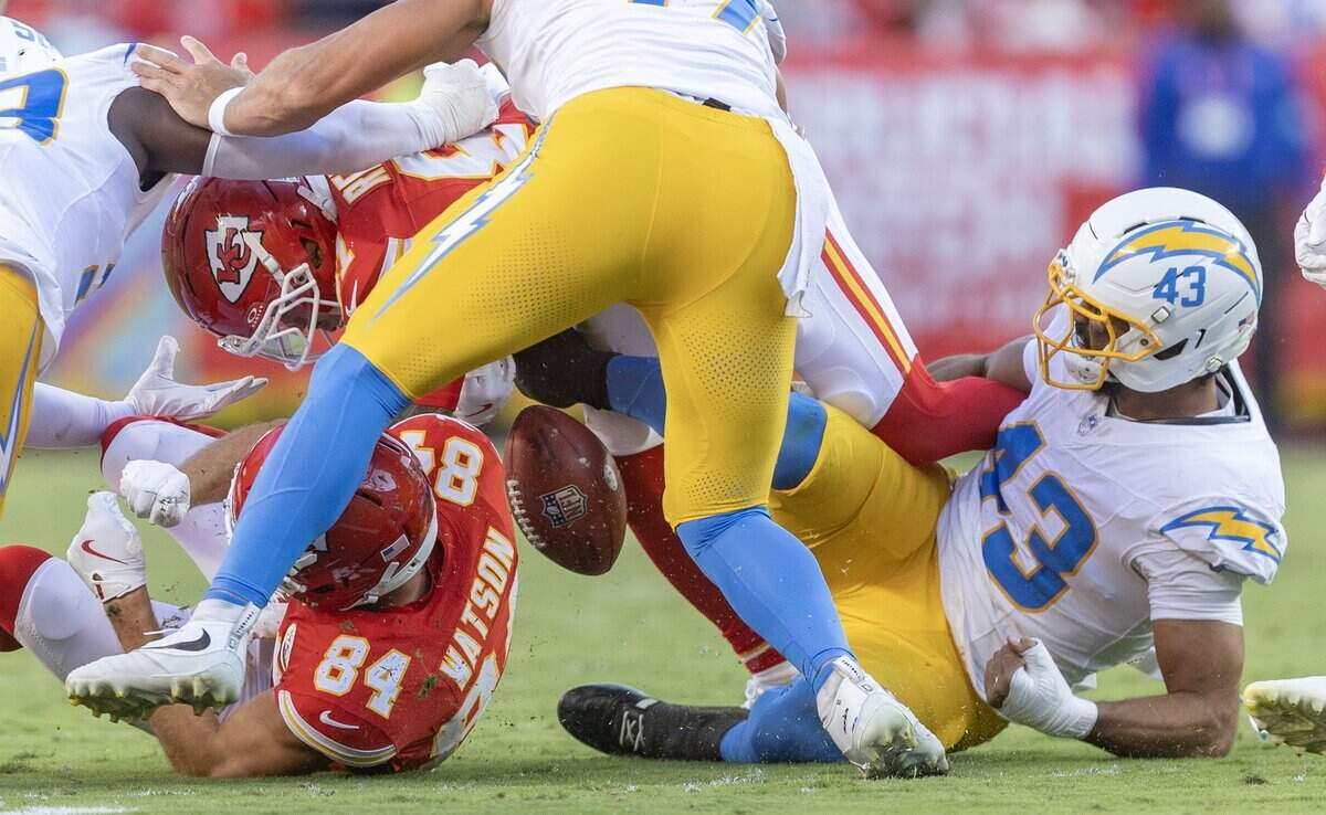 Kansas City Chiefs wide receiver Nikko Remigio (81) fumbles the ball during a punt return that was recovered by Los Angeles Chargers linebacker Troy Dye (43) during the second half on Sunday at Arrowhead Stadium.