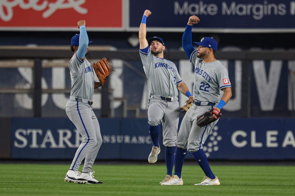 Kansas City Royals left fielder MJ Melendez (1), center fielder Garrett Hampson (2) and left fielder Tommy Pham (22) celebrate after defeating the New York Yankees at Yankee Stadium on Sept. 10, 2024 in Bronx, New York.