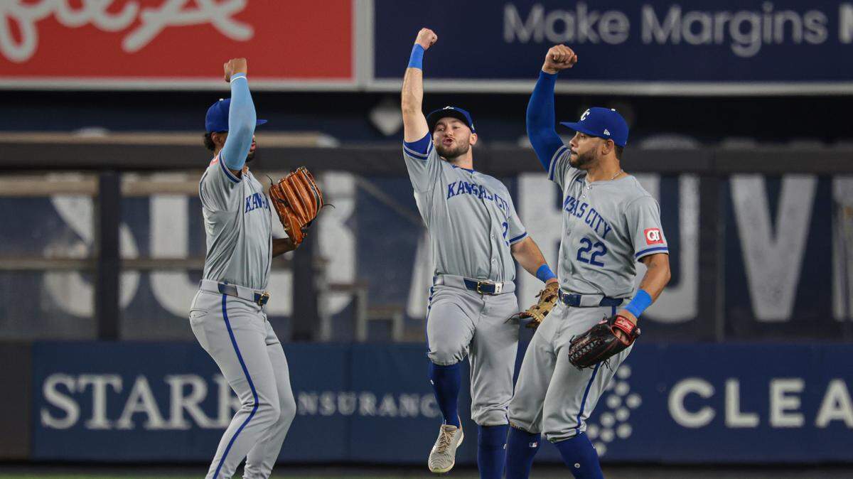 Kansas City Royals left fielder MJ Melendez (1), center fielder Garrett Hampson (2) and left fielder Tommy Pham (22) celebrate after defeating the New York Yankees at Yankee Stadium on Sept. 10, 2024 in Bronx, New York.