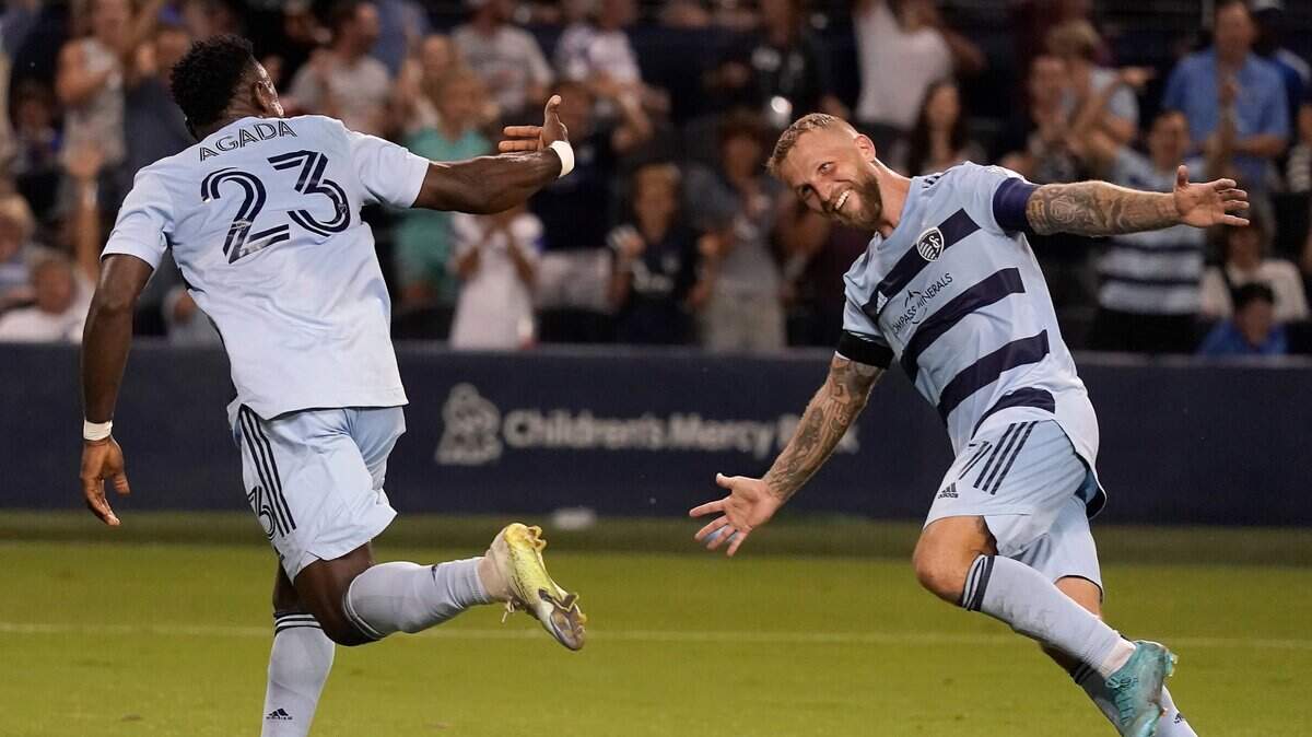 Sporting Kansas City’s William Agada, left, celebrates a goal against Portland with teammate Johnny Russell last Sunday at Children’s Mercy Park in Kansas City, Kan.