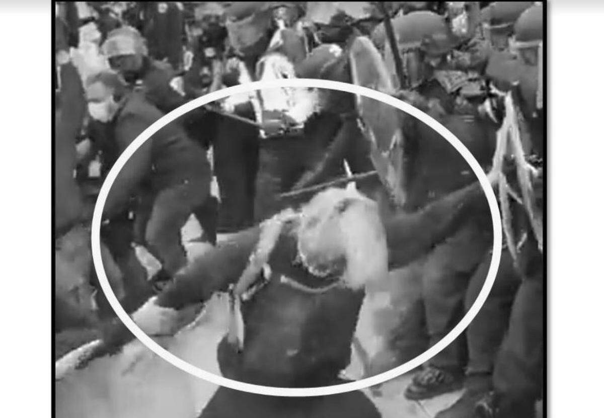 A photo included in charging documents allegedly shows Chancelor Nathan Taylor at the Capitol riots on Jan. 6, 2021.