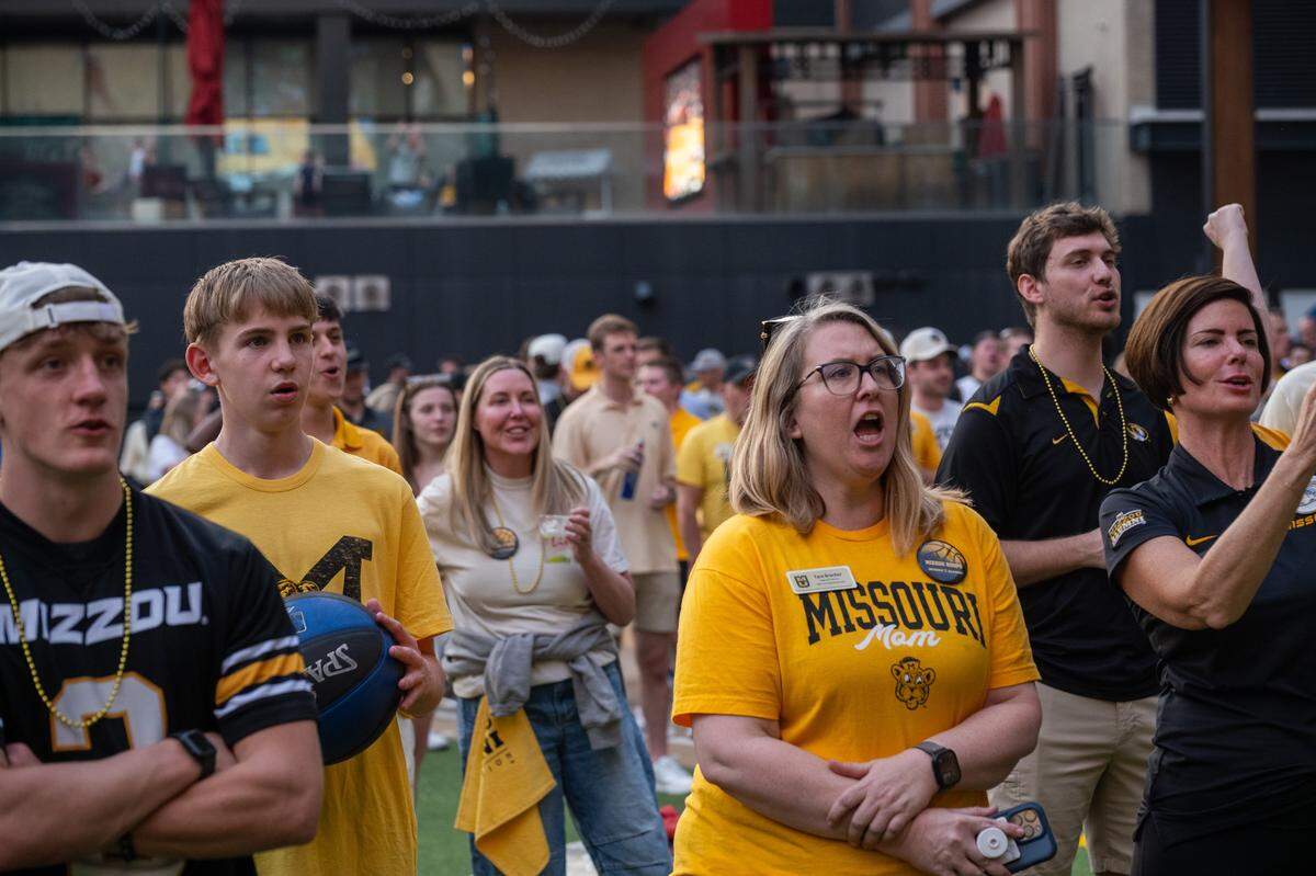 Missouri Tigers fans perform their school chant at the Mizzou Spirit Rally at Ballpark Village on Friday, March 20, 2026, in St. Louis. The Missouri Tigers faced off against the Miami Hurricanes in the first round of the NCAA Men's Basketball Tournament in St. Louis.
