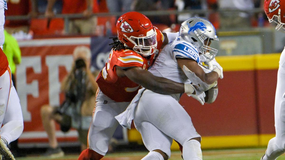 Chiefs linebacker Nick Bolton (32) tackles Detroit Lions running back David Montgomery in the second half on Thursday, September 7, 2023, in the NFL Kickoff opener at GEHA Field at Arrowhead Stadium in Kansas City.