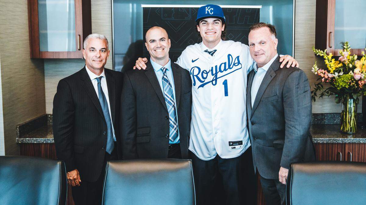 In this file photo, Kansas City Royals 2021 first-round draft pick Frank Mozzicato poses with members of the Royals front office after he signed his contract at Kauffman Stadium on Saturday July 17, 2021, in Kansas City, Mo. Pictured, from left to right, are general manager Dayton Moore, area scout Casey Fahy, Mozzicato, and assistant general manager/amateur scouting Lonnie Goldberg. The Royals on Tuesday promoted Goldberg to vice president/player personnel.