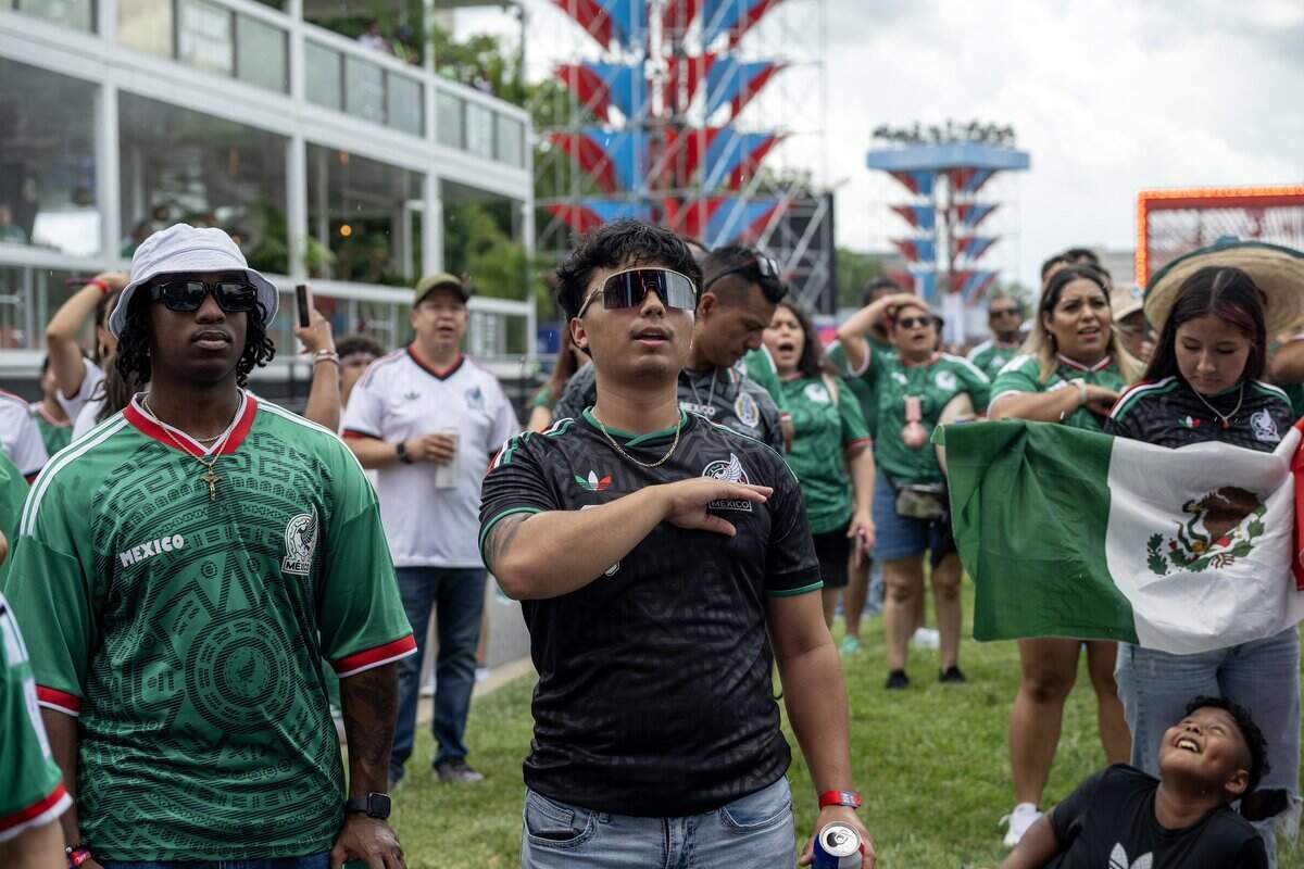 Mexico fans sing the Mexican national anthem before watching a FIFA World Cup match between Mexico and South Africa at the FIFA Fan Festival on Thursday, June 11, 2026, in Kansas City.