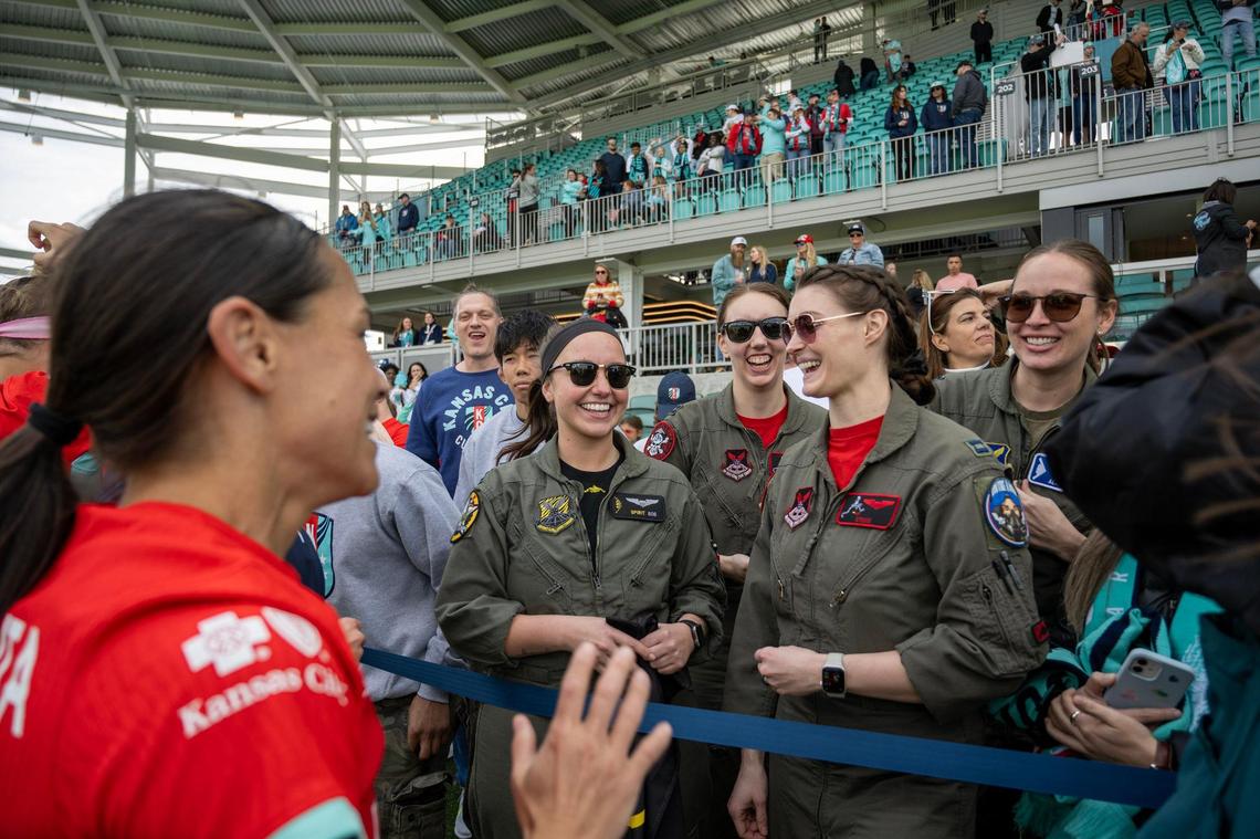 Kansas City Current midfielder Lo’Ear LaBonta greets the all-woman pilots from Whiteman Air Force Base who flew the first all-female, two-ship T-38 flyover over the new CPKC Stadium on Saturday, March 16, 2024, in Kansas City.