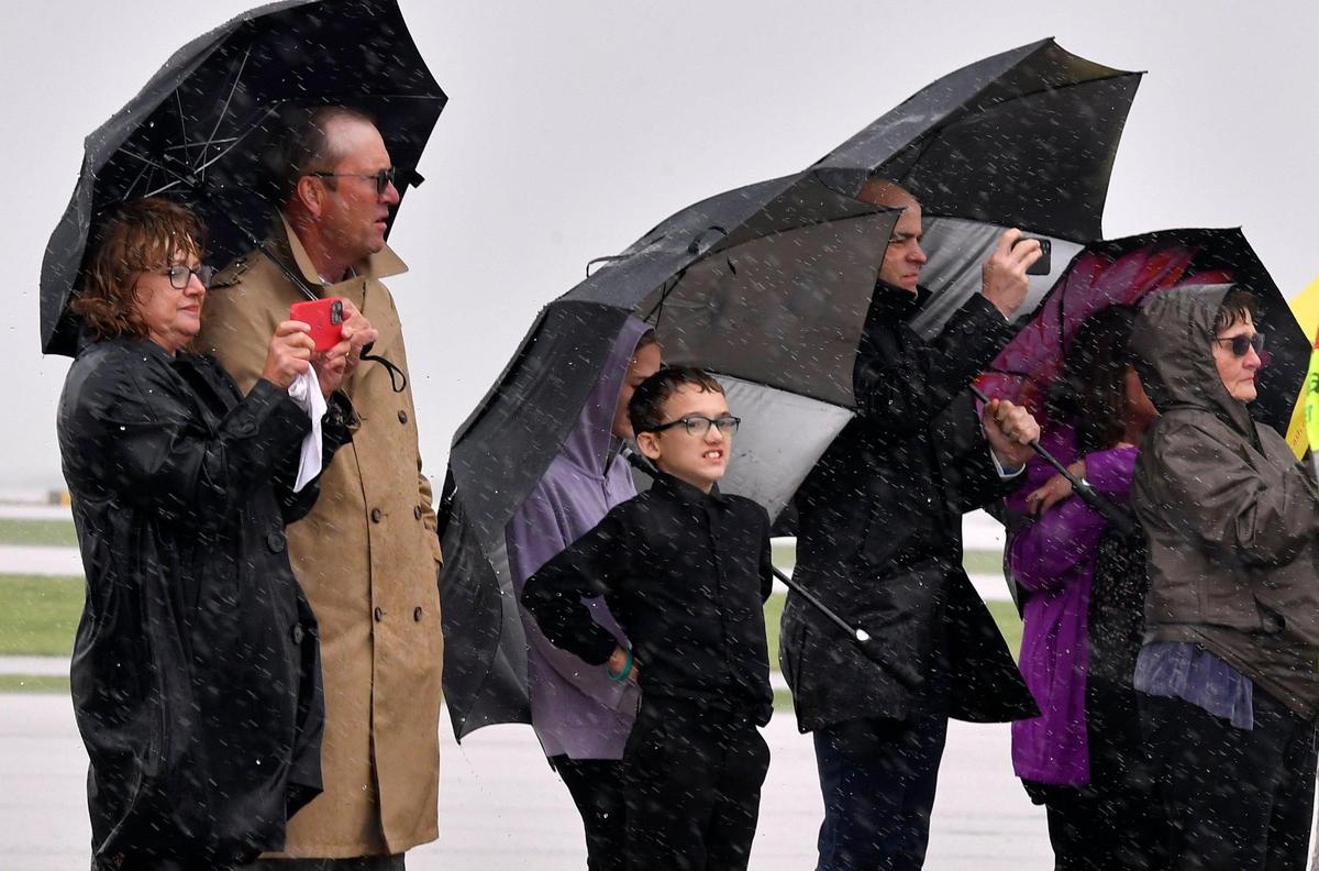 Family members looked on as the remains of Seaman First Class Wilbur F. Newton, who was killed December 7, 1941 while stationed on the U.S.S. Oklahoma at Pearl Harbor, were returned to Missouri aboard a flight Tuesday afternoon at KCI. Newton’s remains were identified earlier this year through DNA testing. His remains have been interred in Hawaii since 1941.