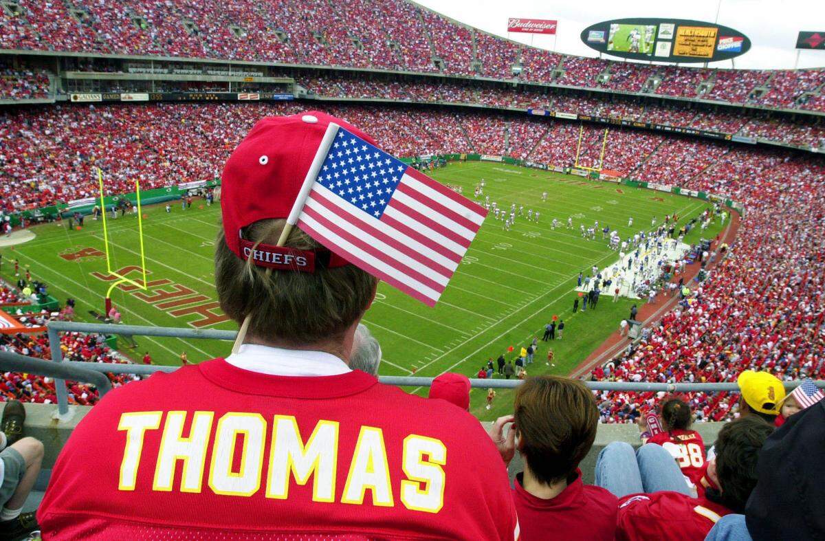 Mike Trompeter, of Overland Park, watches the Chiefs’ Sept 23, 2001 game against the New York Giants at Arrowhead Stadium. The late Derrick Thomas was honored at halftime, his name and number added to the Chiefs’ Ring of Honor.
