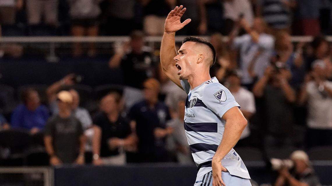 Sporting Kansas City midfielder Erik Thommy celebrates a goal during the second half of an MLS soccer match against the Portland Timbers Sunday, Aug. 21, 2022, in Kansas City, Kan. (AP Photo/Charlie Riedel)