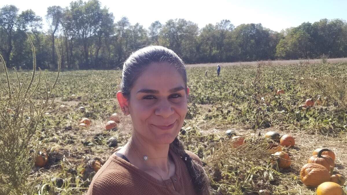 Noora Al Mafraji smiles as she gets her picture taken near a pumpkin patch. She was killed in a crash involving a suspected drunk driver on Christmas Eve in 2023. Her family remembers her for being devoted and selfless, her husband Saif Mahdi said.