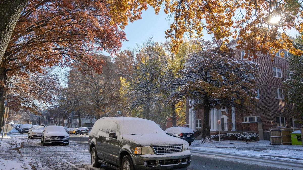Snow blankets vehicles along Armour Boulevard following Kansas City’s first snowfall of the season on Sunday, Nov. 26, 2023.