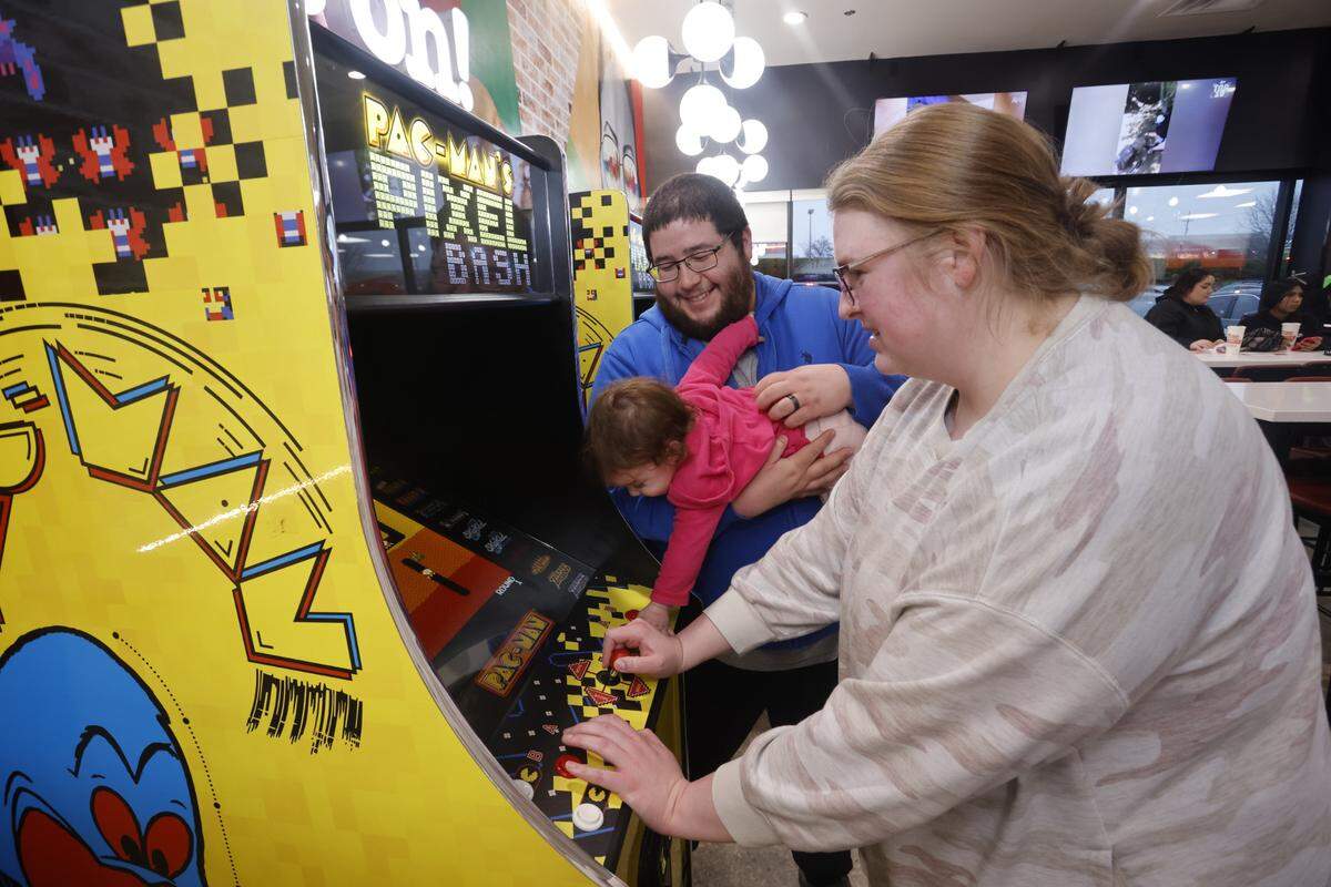 Customers play games at the Peter Piper Pizzeria soft opening on March 8 in Olathe.