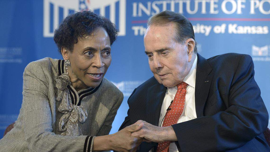 Former University of Kansas chancellor Bernadette Gray-Little visited with Bob Dole during a visit to the Dole Institute of Politics on the KU campus in 2014.