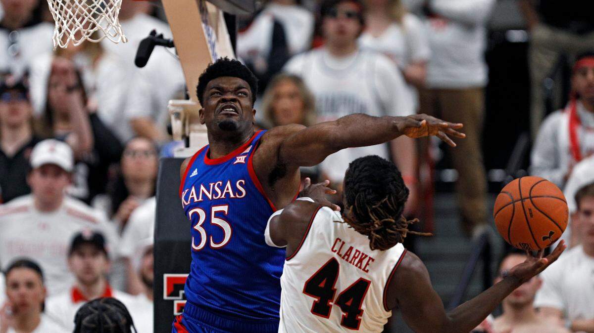 Kansas’ Udoka Azubuike (35) blocks a shot by Texas Tech’s Chris Clarke (44) during the first half of an NCAA college basketball game Saturday, March 7, 2020, in Lubbock, Texas. (AP Photo/Brad Tollefson)