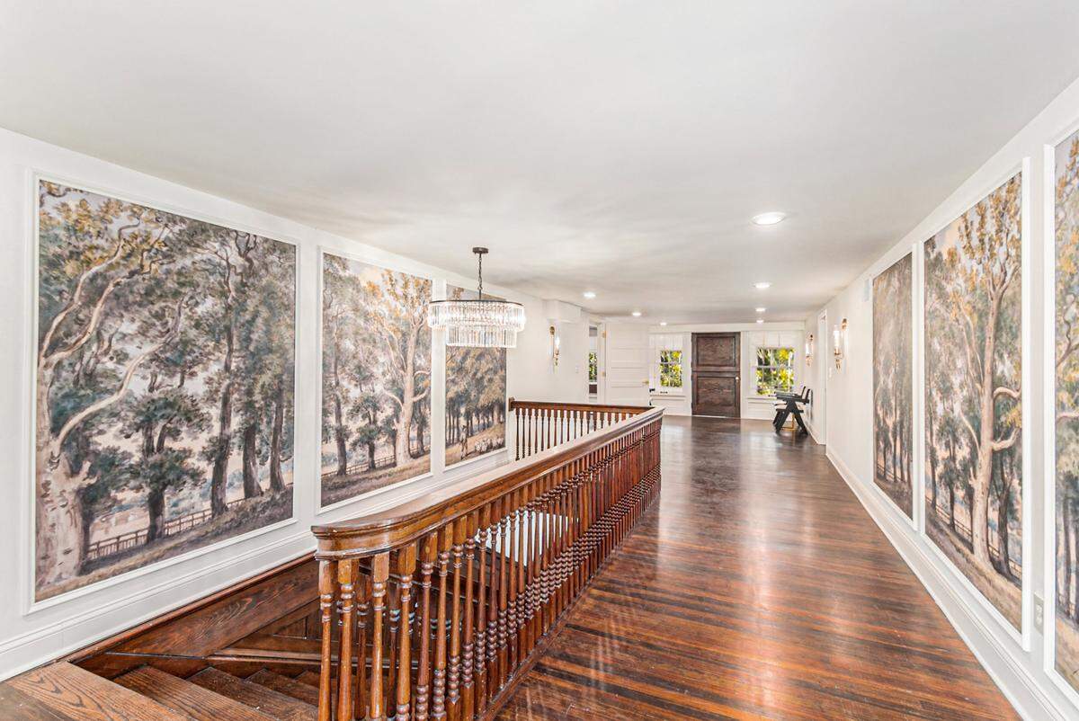 The second floor landing at the circa 1902 William Rockhill Nelson “clubhouse.” The floors, staircase and banisters are original to the the renovated home.