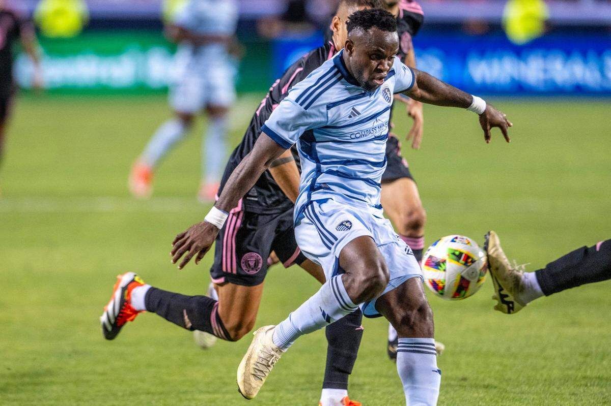 Sporting Kansas City forward Willy Agada (23) is blocked by Inter Miami defenders in the second half during an MLS game at GEHA Field at Arrowhead Stadium on Saturday, April 13, 2024, in Kansas City.