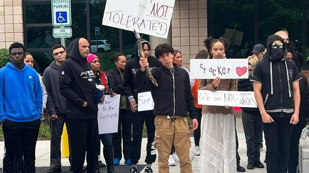More than 40 Olathe students, parents and community members gathered in front of school district headquarters on Monday to demand officials take incidents of racism more seriously.