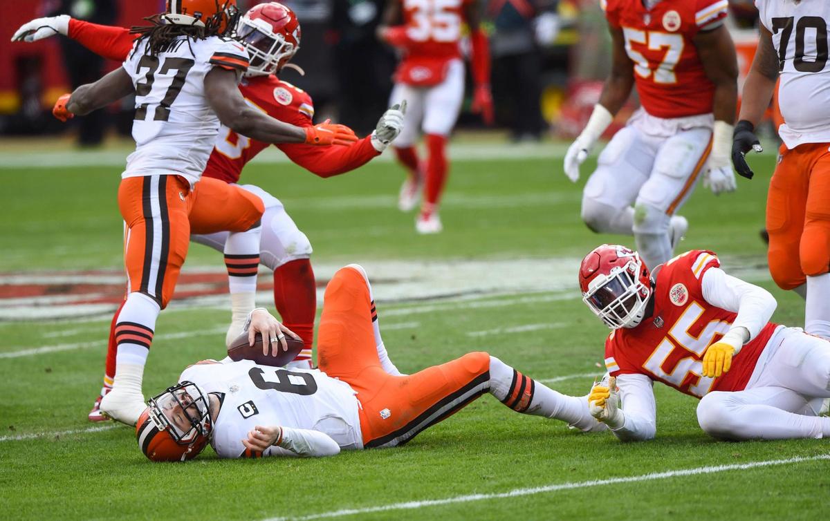 Cleveland Browns quarterback Baker Mayfield hit the ground hard after being hit by Kansas City Chiefs defensive end Frank Clark Sunday, January 17, 2021, at Arrowhead Stadium in Kansas City, Missouri.