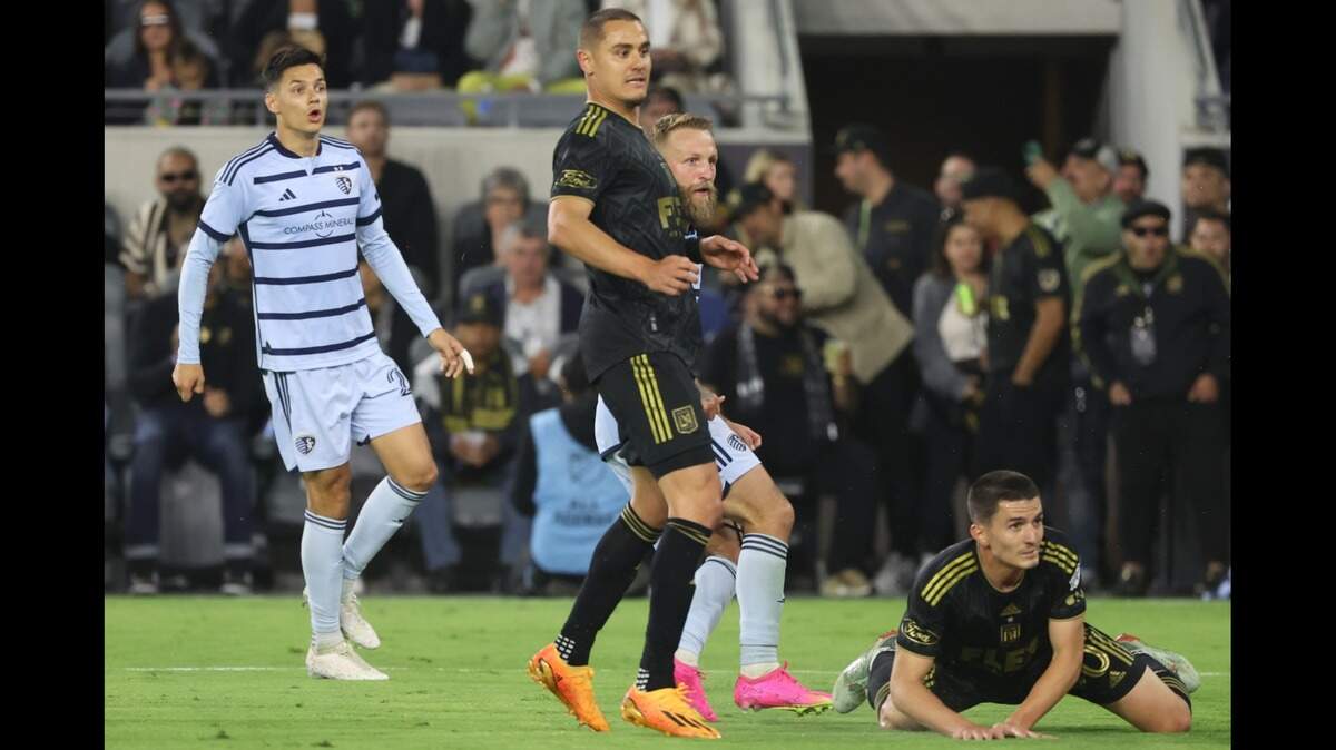 Sporting KC forward Johnny Russell, in background at center of photo, brought his club level with a first-half goal against LAFC on Wednesday night at BMO Stadium in Los Angeles.