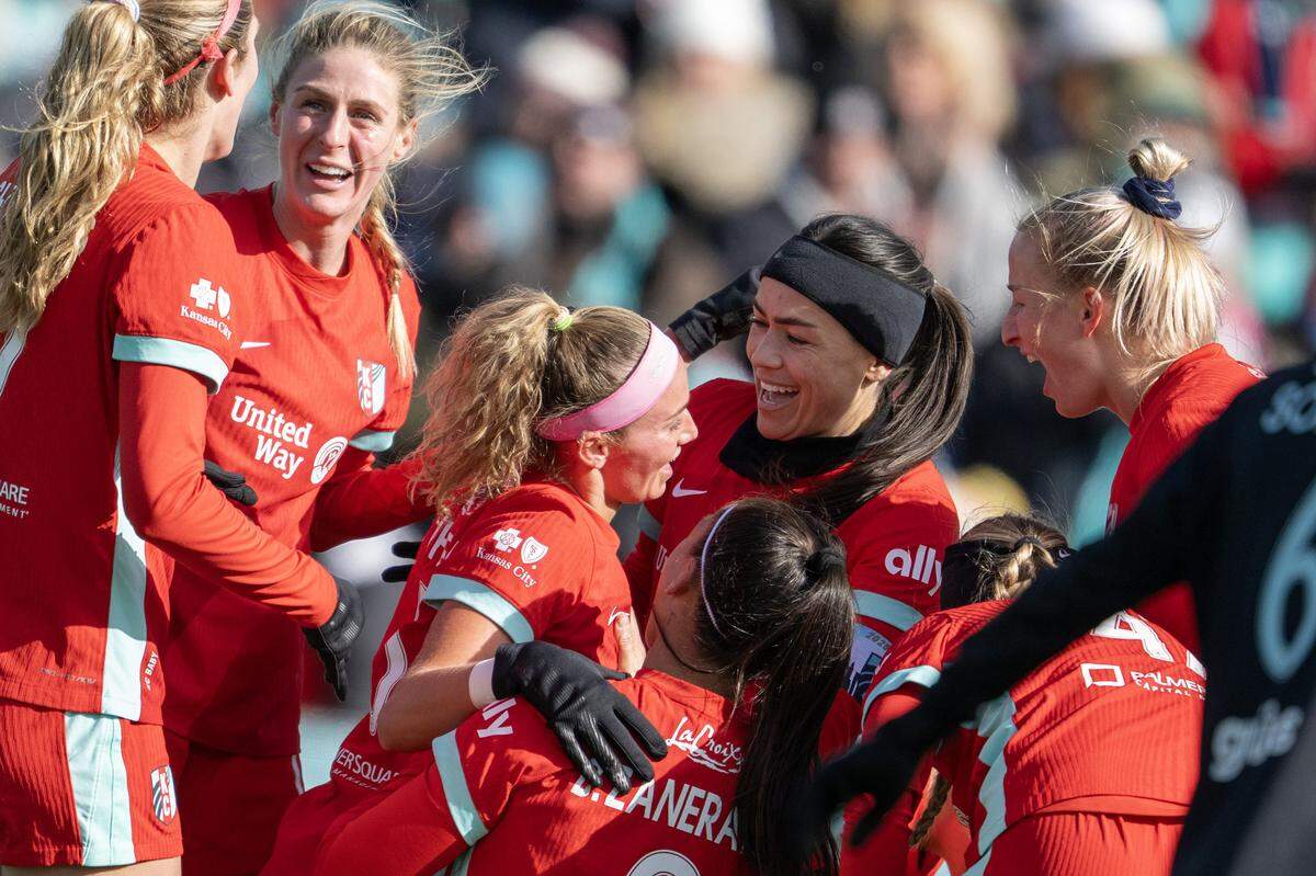 KC Current players celebrate a goal against Gotham by defender Ellie Wheeler (No. 5) during an NWSL quarterfinal playoff match at CPKC Stadium in Kansas City on Sunday, Nov. 9, 2025.