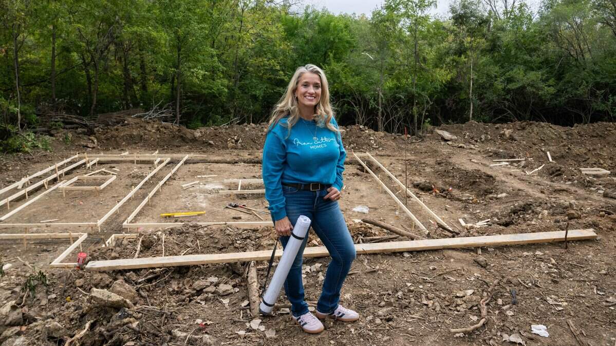 Fran Sutton, a real estate broker-turned-developer in Kansas City, Kansas, stands in a lot on Oct. 9, 2025. Sutton is trying to address a local housing shortage by tapping into vacant and abandoned lots that KCK has in its land bank.