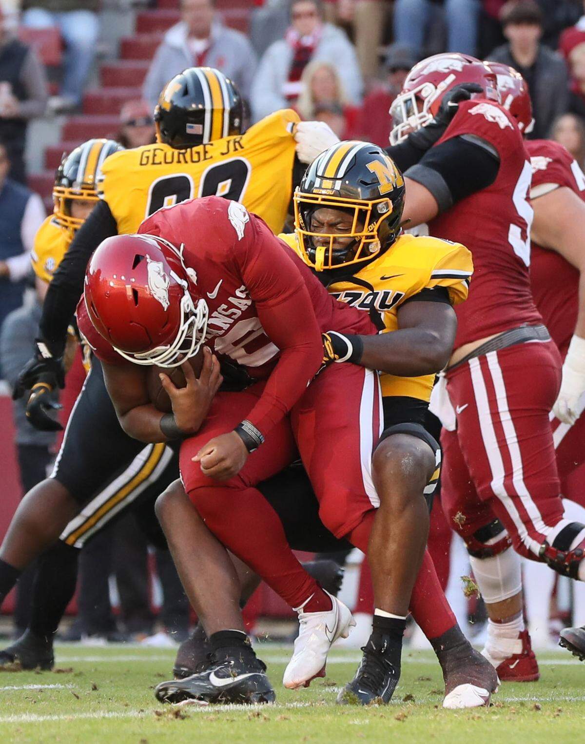 Missouri Tigers linebacker Brayshawn Littlejohn brings down Arkansas Razorbacks quarterback Jacolby Criswell during Friday afternoon’s Battle Line Rivalry game at Donald W. Reynolds Razorback Stadium in Fayetteville, Ark.